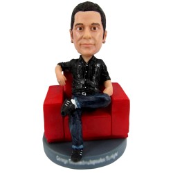 Casual Male Sitting On Sofa