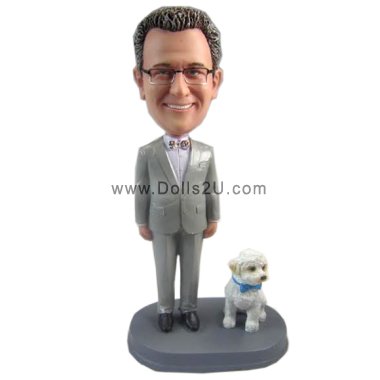 Male and a dog bobblehead doll