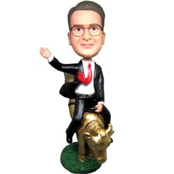 Male Riding Golden Bull Bobblehead