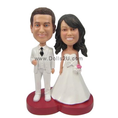 Custom bride and groom wedding bobbleheads cake topper