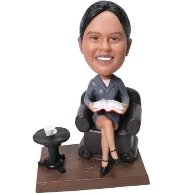 (image for) Custom Bobblehead Business Woman Sitting On A Couch Reading A Book